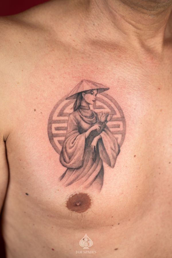 Portrait tattoo of Vietnamese woman in áo dài and nón lá on chest at 3 Of Spades Tattoo Hanoi