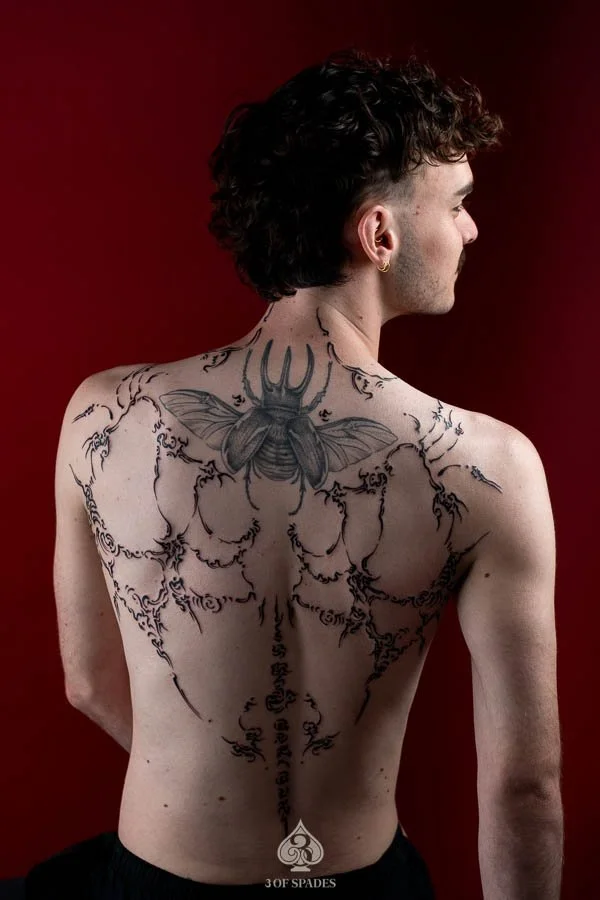 Asemic Scripture Back Tattoo | 3 of Spades Hanoi Tattoo