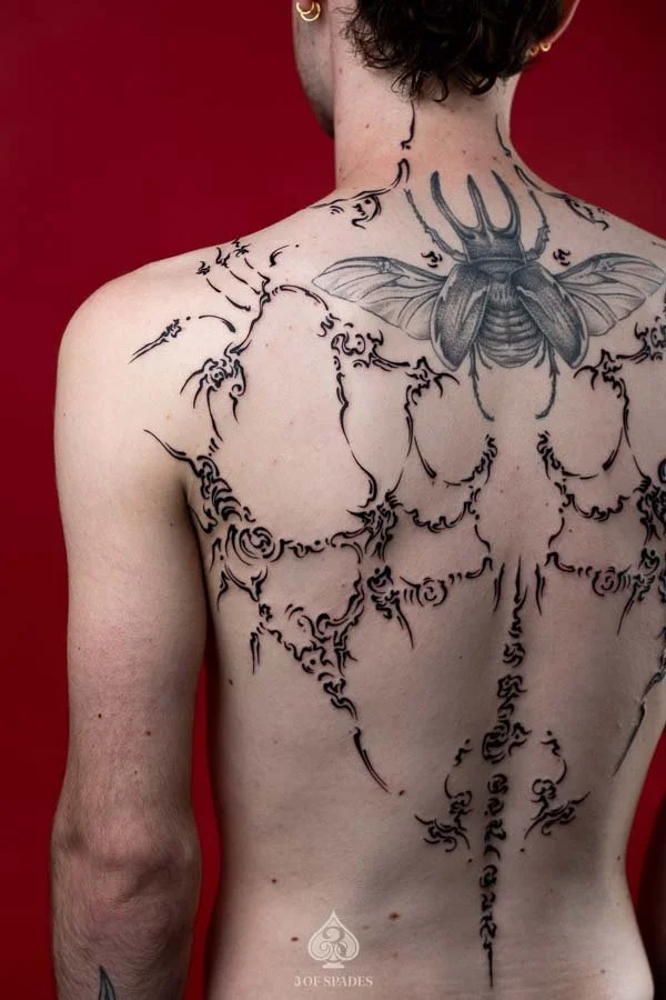 Asemic Scripture Back Tattoo | 3 of Spades Hanoi Tattoo