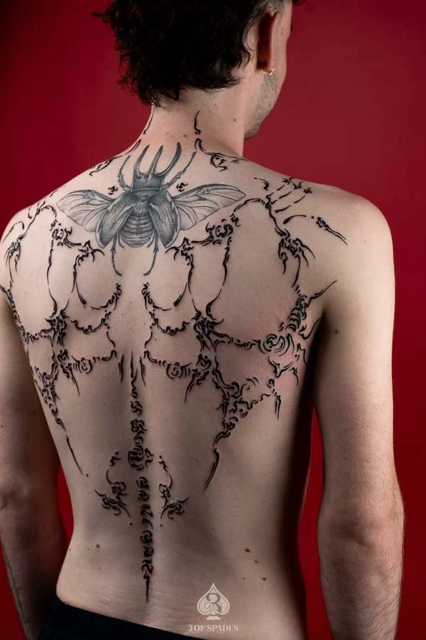 Asemic Scripture Back Tattoo | 3 of Spades Hanoi Tattoo