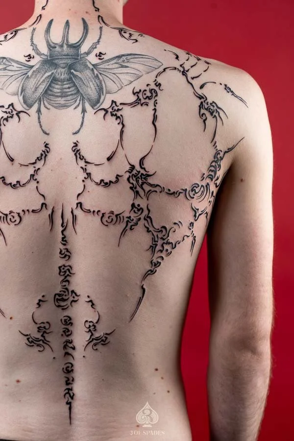 Asemic Scripture Back Tattoo | 3 of Spades Hanoi Tattoo