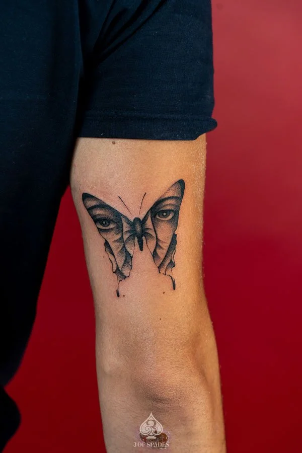Fine Line Red Butterflies Tattoo featuring delicate red butterfly outlines, elegant wing details, and minimalist linework at 3 of Spades Hanoi Tattoo | Realism tattoo
