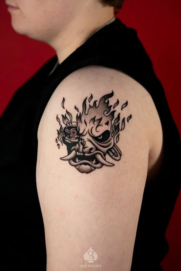tattoo style Blackwork Cyberpunk Samurai Tattoo concept featuring a futuristic Japanese warrior with cybernetic armor, a stylized samurai helmet, mechanical details, and bold black ink shading.