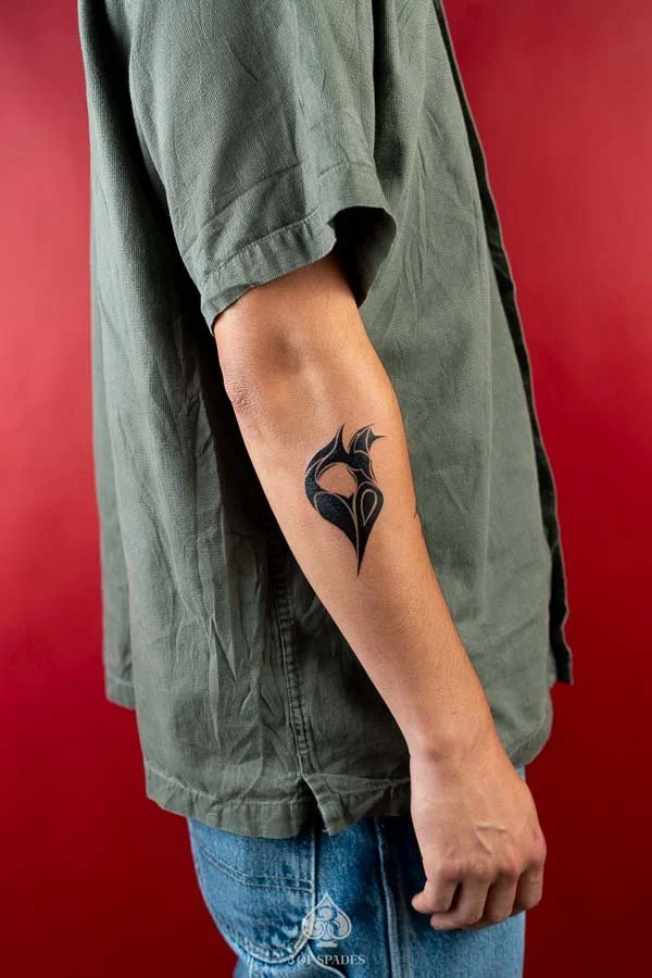 Blackwork Heart Logo Tattoo