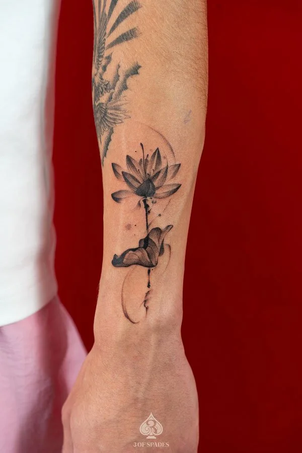 Blackwork Lotus Arm Tattoo