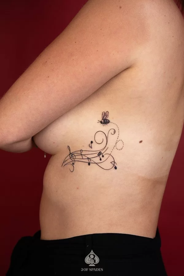 Blackwork Music Note Tattoo