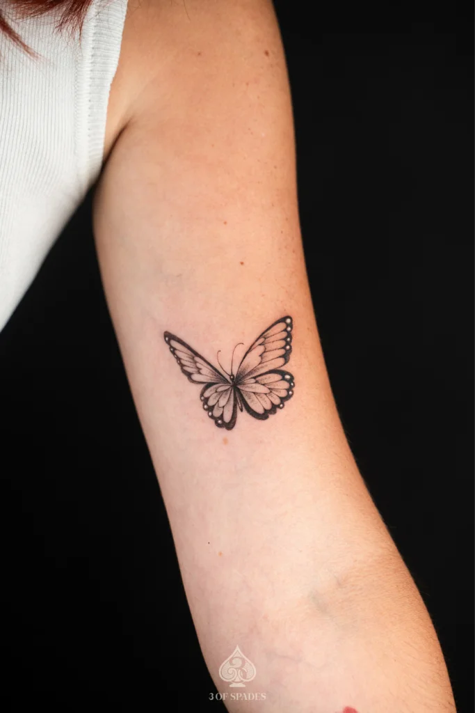 Butterfly Bicep Tattoo | 3 of Spades Hanoi Tattoo