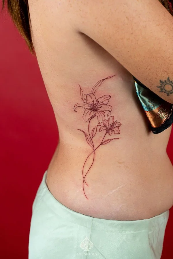 Fine Line Red Lily Flower Hip Tattoo