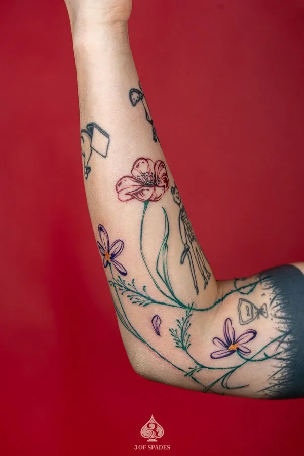 Growing Color Flower Arm Tattoo
