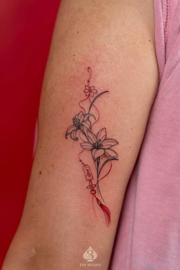 Lily Follower Tricep Tattoo