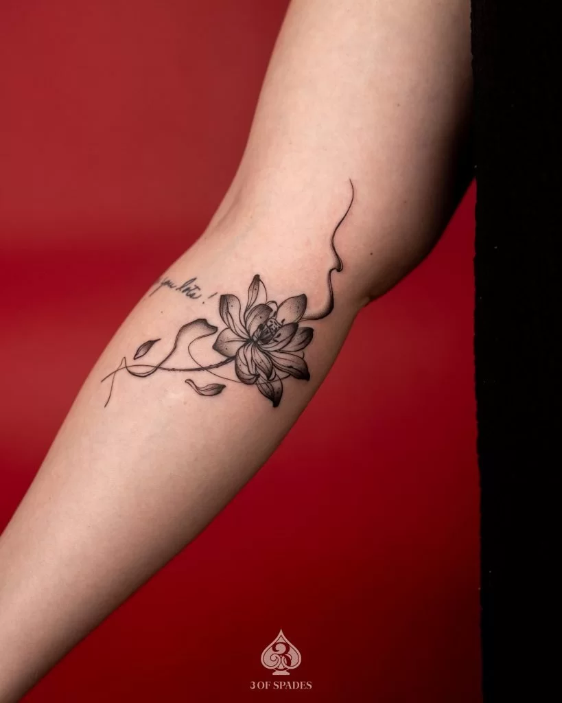 Micro-blackwork Lotus Tattoo