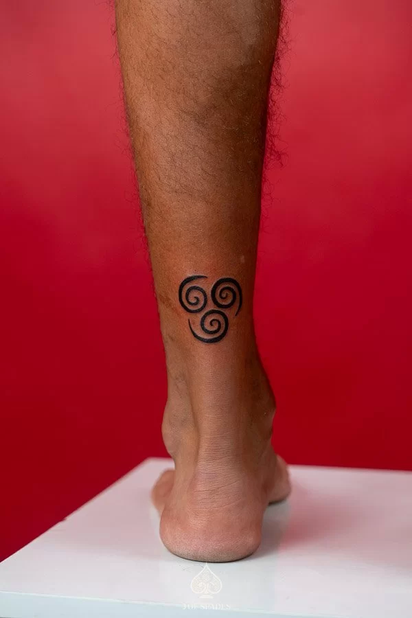 Micro-blackwork Spiral Tattoo