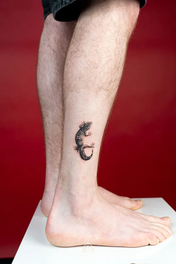 Micro-realism Gecko Tattoo concept featuring a miniature lifelike gecko with detailed eyes, textured skin, delicate toes, and subtle realistic shading at 3 of Spades Hanoi Tattoo.