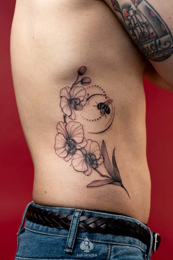Orchid Flower Rib Tattoo