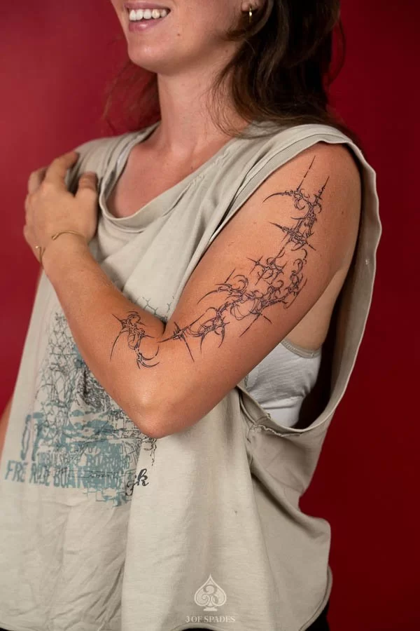 Upper Arm Sigilism Tattoo