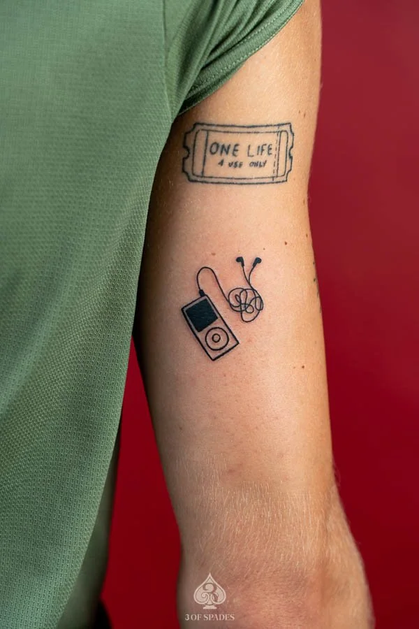 Vinyl Record Player and MP3 Blackwork Tattoo featuring retro music technology, bold black ink, and graphic details at 3 of Spades Hanoi Tattoo.