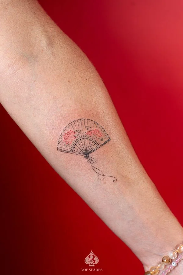 Fine Line Red Lotus Fan Tattoo