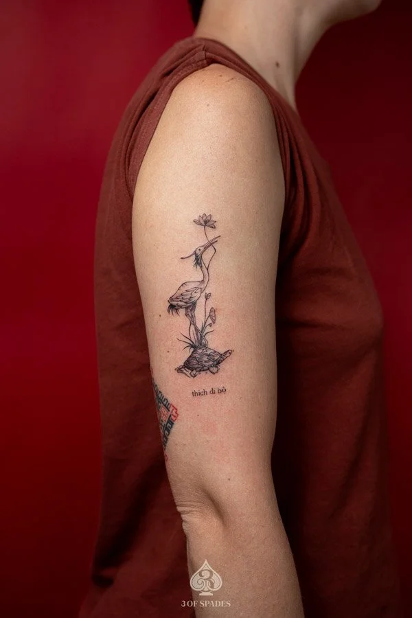 Fine Line Crane on Turtle tattoo_3 of Spades Hanoi Tattoo
