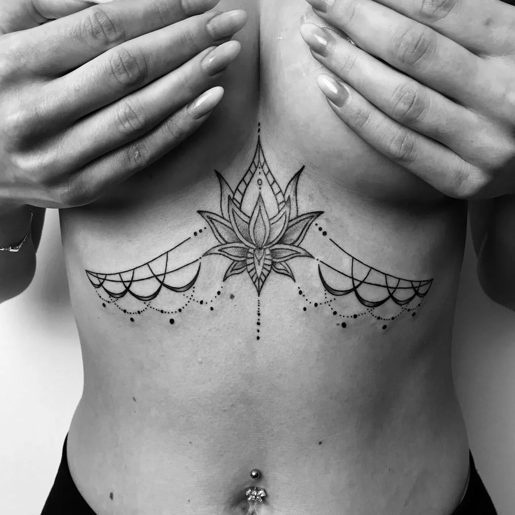 Ornamental underboob breast tattoo