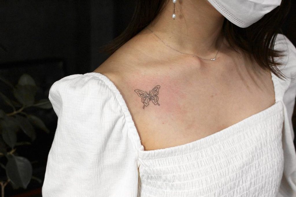 butterfly breast tattoo for girl