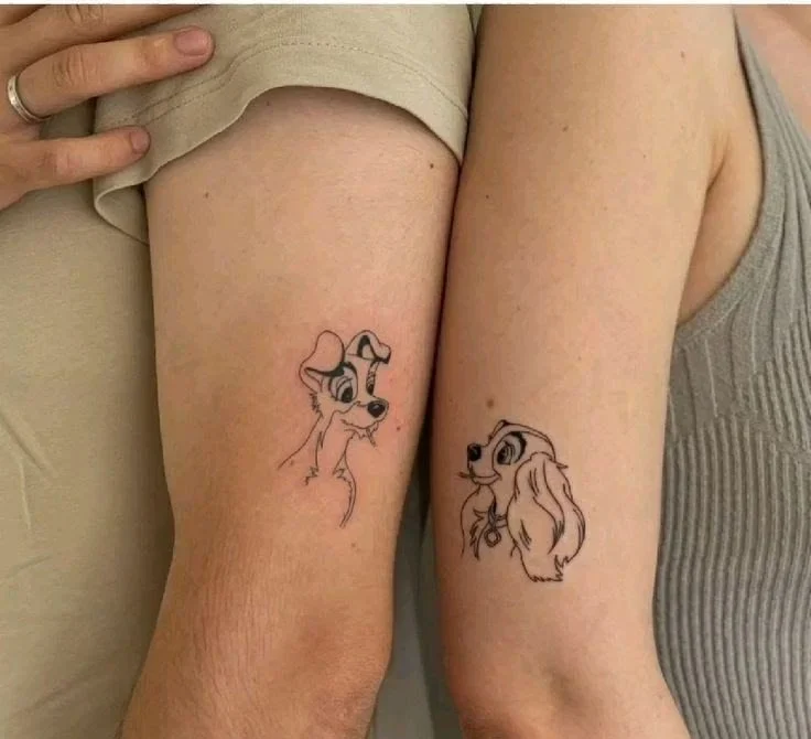 matching cartoon character couple tattoo