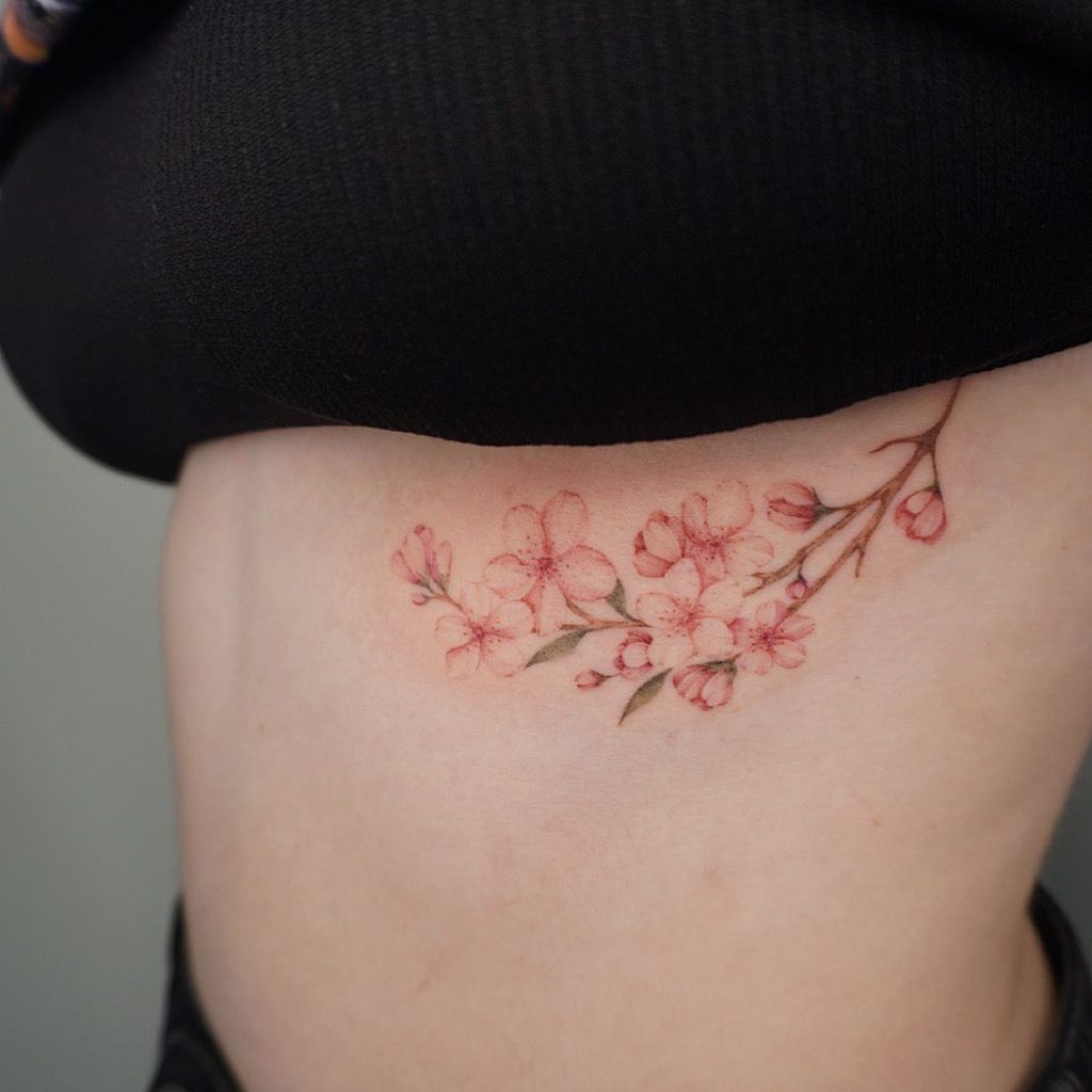 cherry blossom side breast tattoo for women