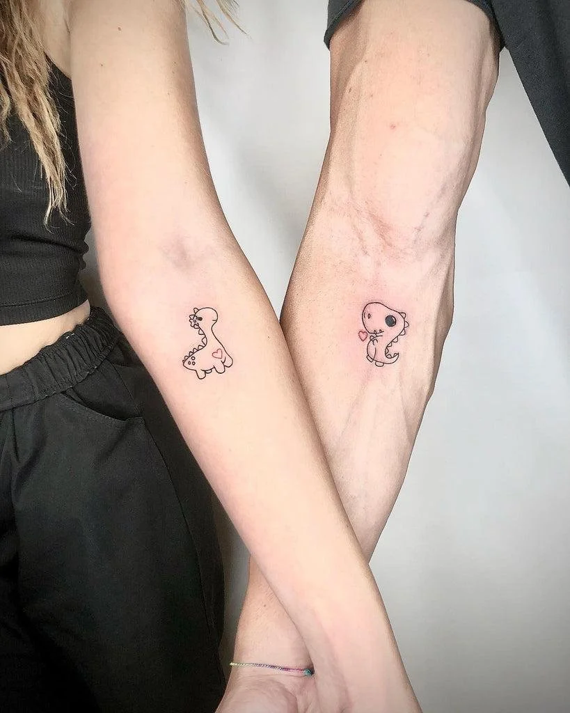 dinosaur couple tattoo