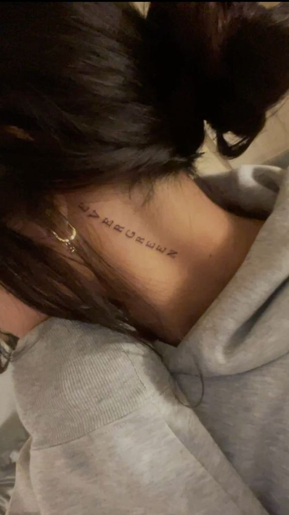 near the hairline behind ear tattoo
