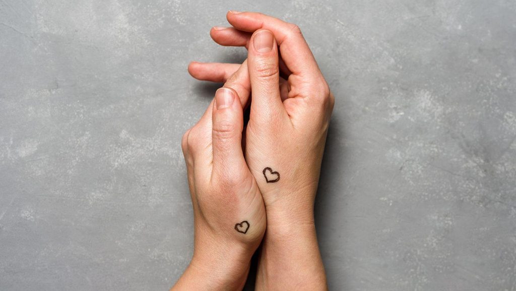 heart symbols couple tattoo