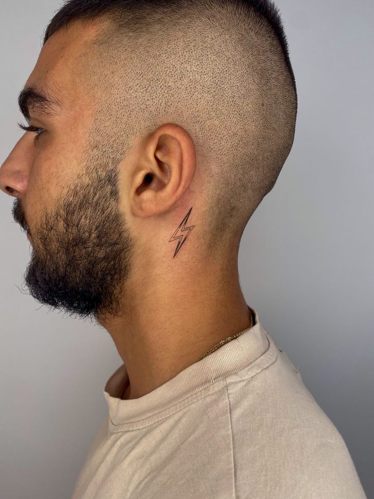 lightning bolt behind ear tattoo idea