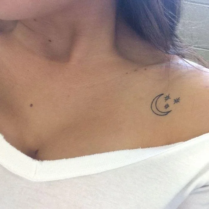 small moon breast tattoo