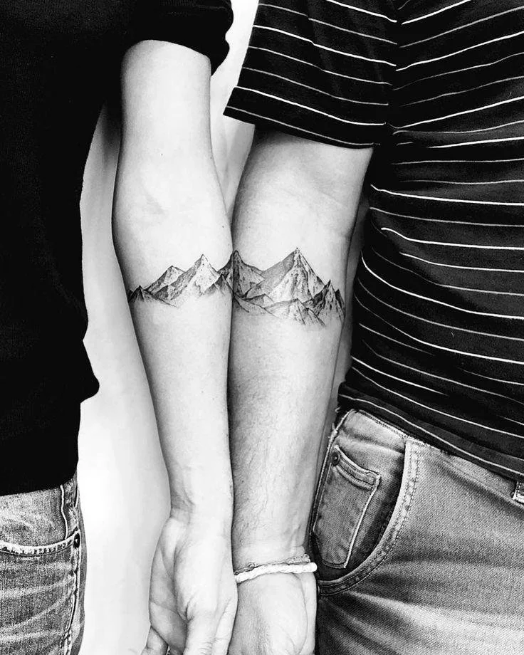 matching mountain couple tattoo