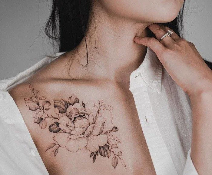 upper peony breast tattoo