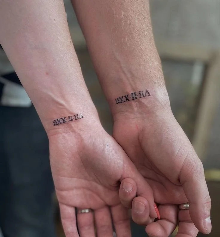 couple tattoo roman number design
