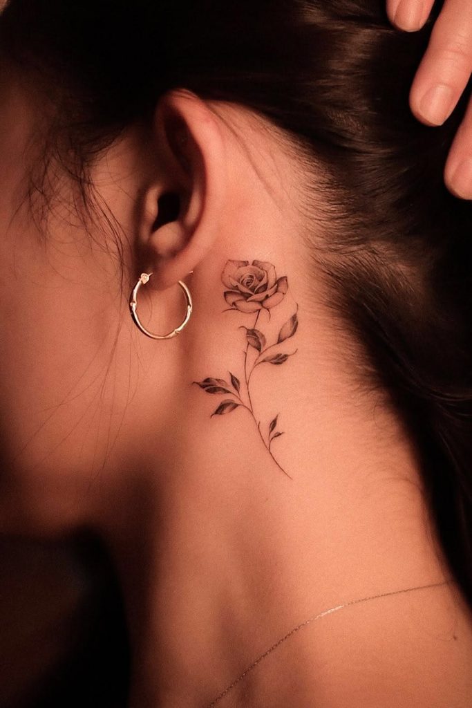fineline rose behind ear tattoo
