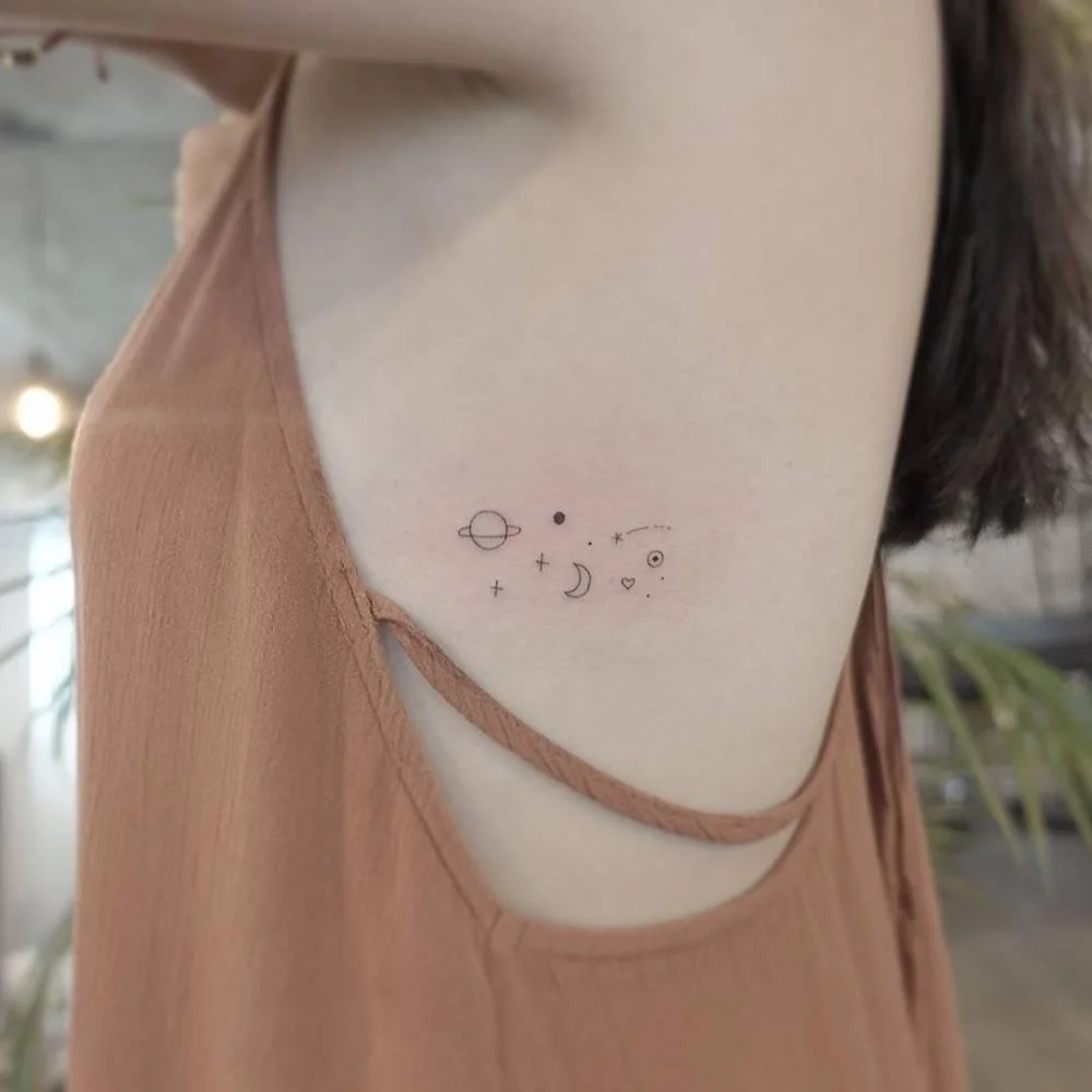 side breast tattoo star and moon