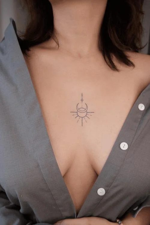 center breast tattoo sun and moon