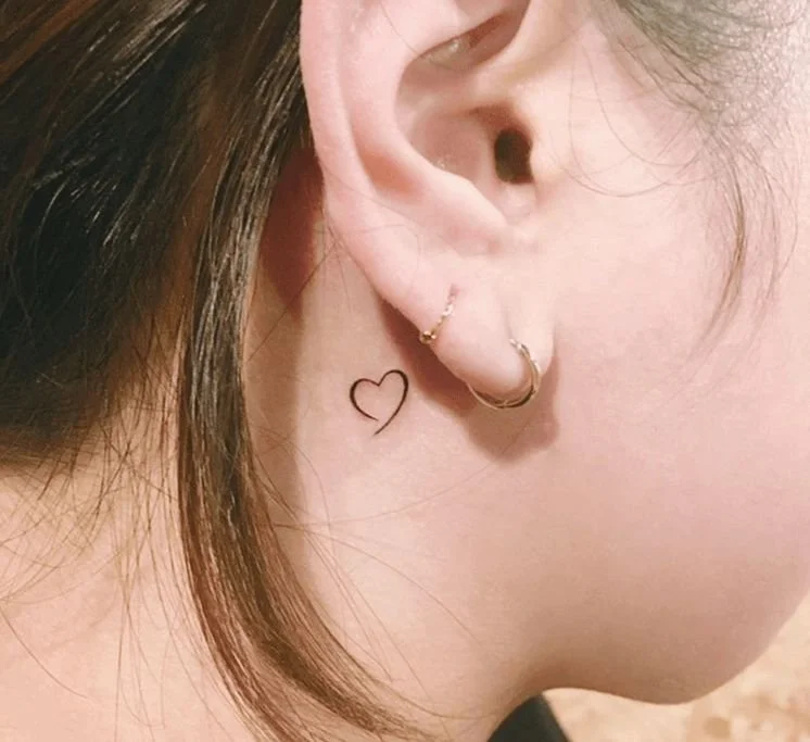 small heart design behind ear tattoo