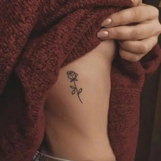 rose side breast tattoo for women