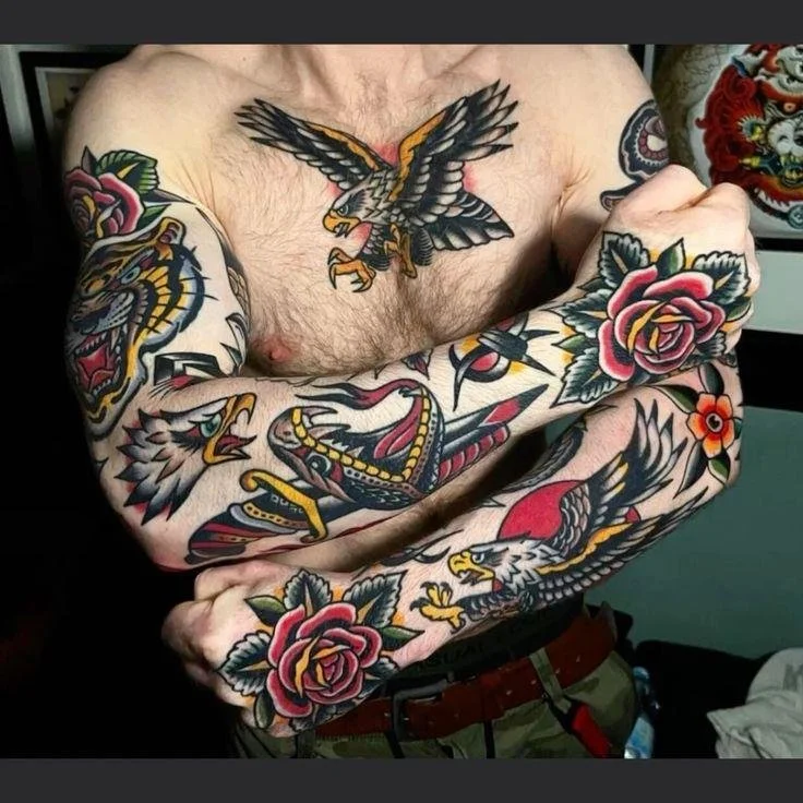 American Traditional Tattoo History represented by classic tattoo flash featuring roses, swallows and anchors