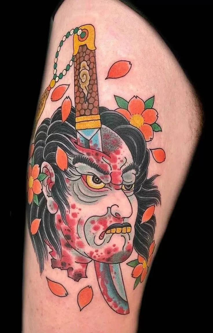 Namakubi Tattoo  | A severed head with wide-open eyes 