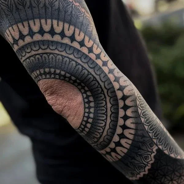 Blackwork Tattoo History illustrated through bold black ink, geometric patterns and contemporary tattoo artistry