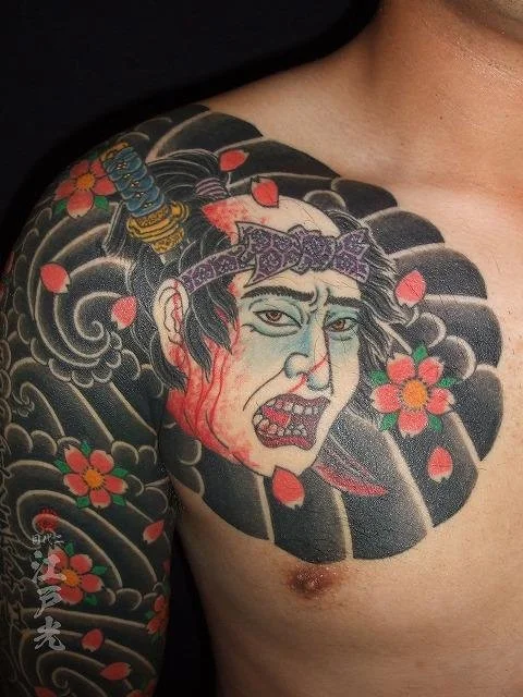 A Namakubi Tattoo depicts a severed human head