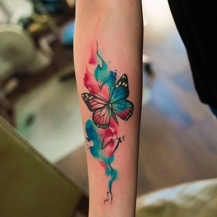 tattoo style Watercolor tattoos imitate effects associated with watercolor painting, including soft gradients, expressive color transitions, and irregular edges.